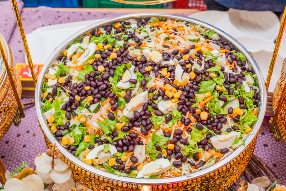 Black bean, corn and cabbage salad in a brass bowl.